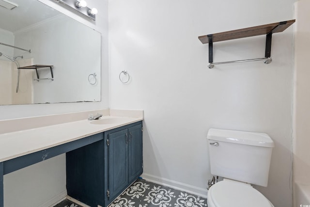 bathroom featuring vanity, ornamental molding, and toilet