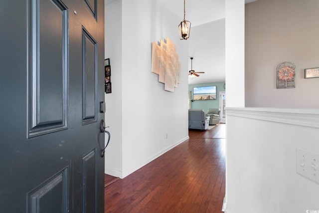 foyer entrance featuring dark wood-type flooring and ceiling fan