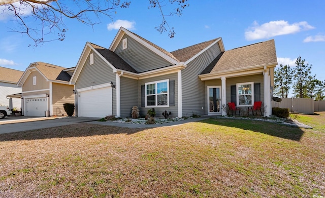 view of front of property with a garage and a front lawn