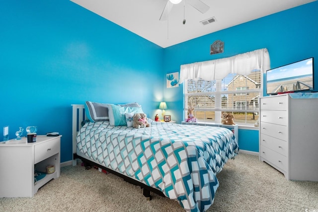 bedroom with light carpet and ceiling fan