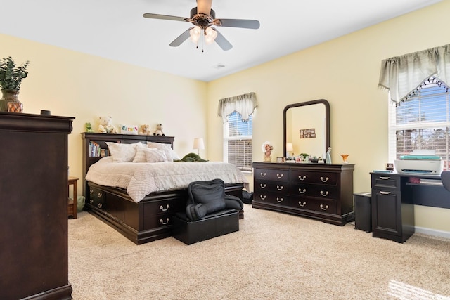 carpeted bedroom featuring ceiling fan