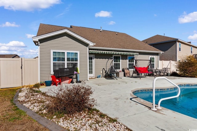 back of property featuring a patio