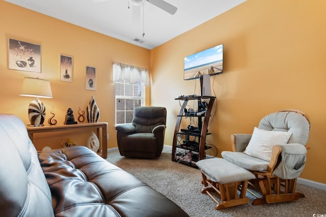 living room featuring carpet floors and ceiling fan