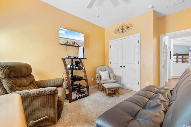 interior space with light colored carpet and ceiling fan