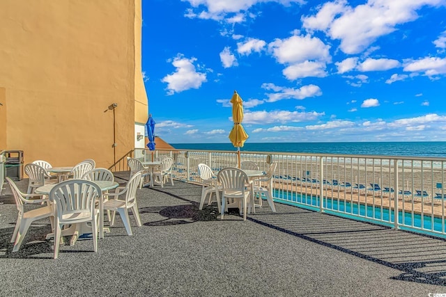 9550 Shore Dr Unit 1721, Myrtle Beach, SC 29572 - view of patio with outdoor dining area and a water view