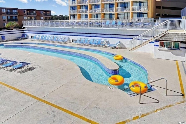 9550 Shore Dr Unit 1721, Myrtle Beach, SC 29572 - community pool featuring a patio and stairway