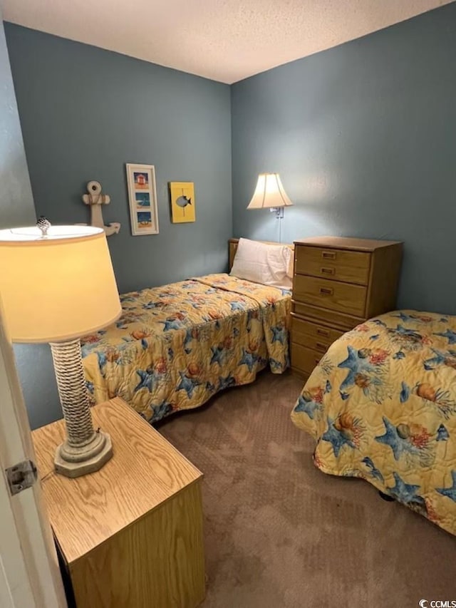 9550 Shore Dr Unit 1721, Myrtle Beach, SC 29572 - carpeted bedroom with a textured ceiling
