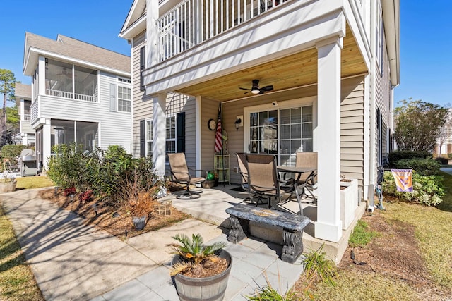 rear view of house featuring a balcony, a patio, and ceiling fan