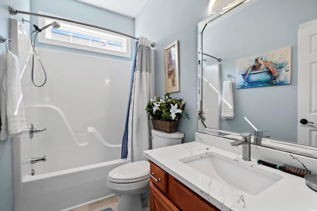 full bathroom with vanity, shower / bath combo, and toilet