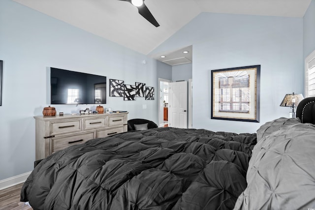 bedroom with ceiling fan, lofted ceiling, and dark hardwood / wood-style flooring