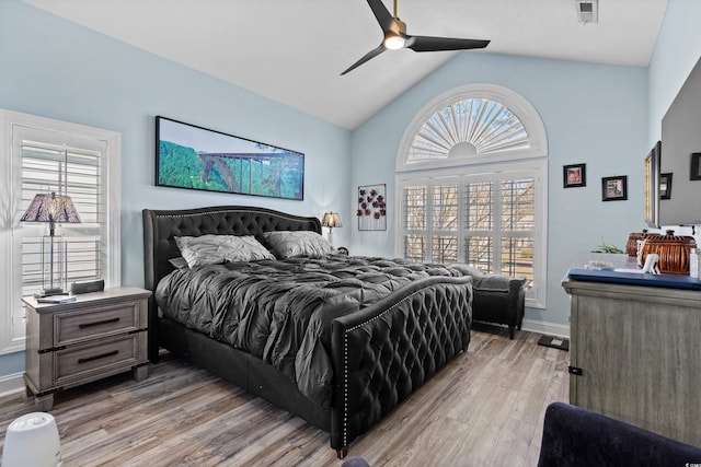 bedroom featuring vaulted ceiling, ceiling fan, and light hardwood / wood-style floors