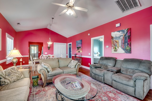 living room featuring ceiling fan, vaulted ceiling, and hardwood / wood-style floors