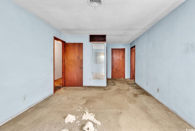 unfurnished bedroom featuring light colored carpet