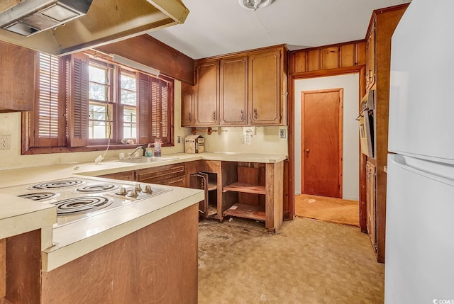 kitchen featuring white appliances and sink