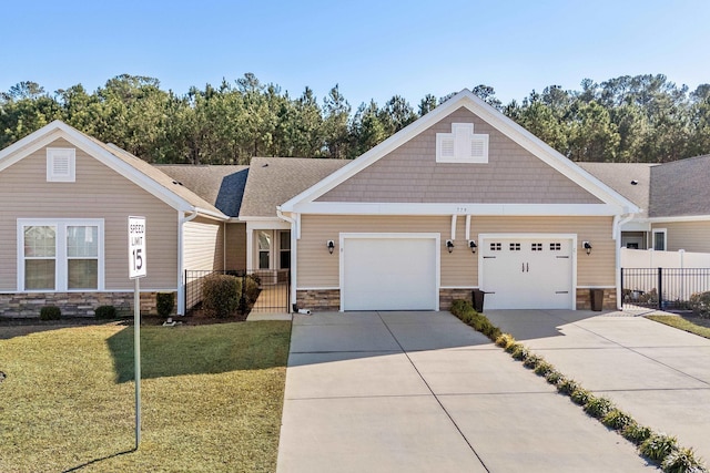 view of front of home with a garage and a front lawn