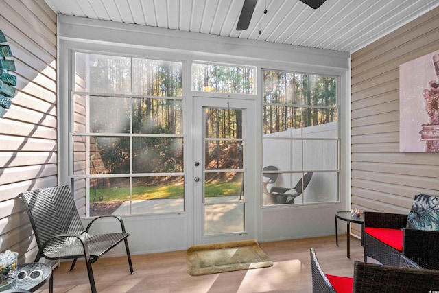 sunroom / solarium with ceiling fan and a healthy amount of sunlight