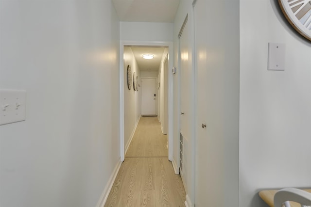 hallway featuring light hardwood / wood-style floors