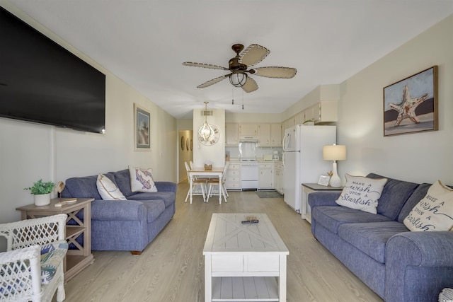 living room featuring ceiling fan and light wood-type flooring