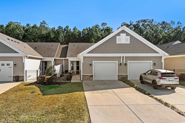 view of front of property featuring a garage and a front yard