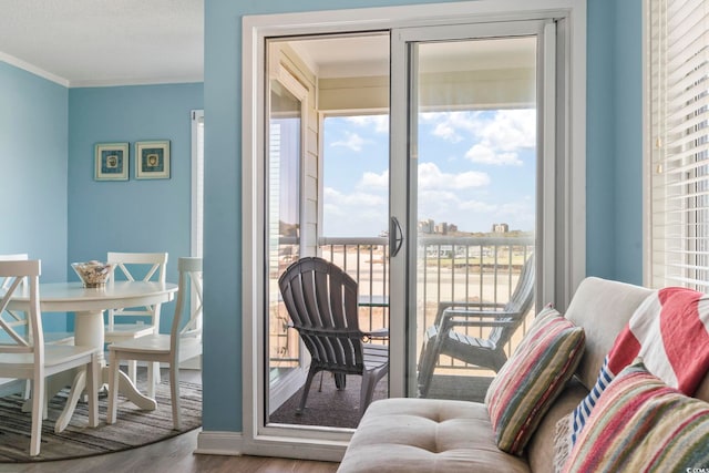 interior space featuring crown molding and hardwood / wood-style floors