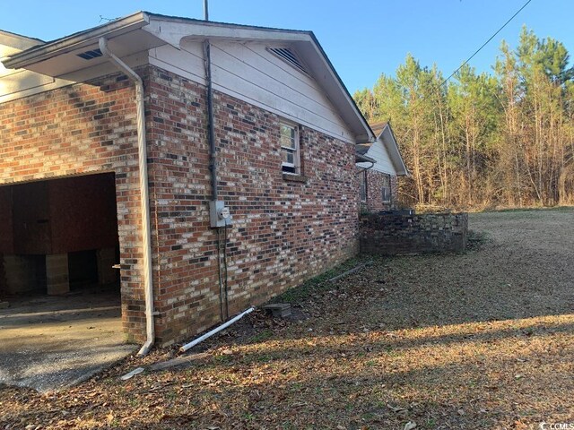 view of property exterior featuring a garage