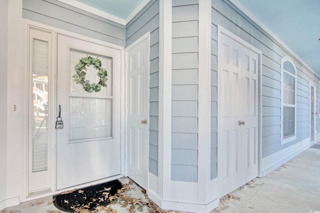 foyer with wooden walls