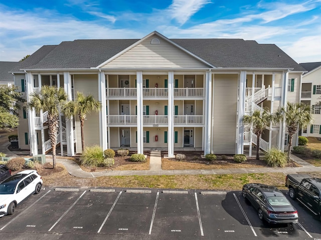 view of property with uncovered parking