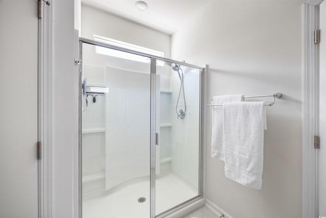 full bathroom featuring a stall shower