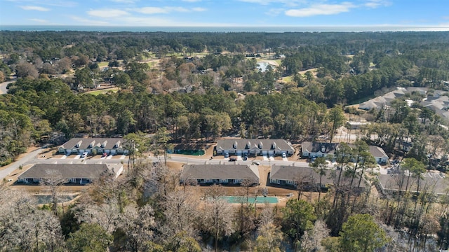 bird's eye view featuring a residential view and a forest view