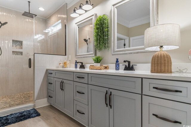 kitchen featuring white cabinetry, an island with sink, and wall chimney range hood