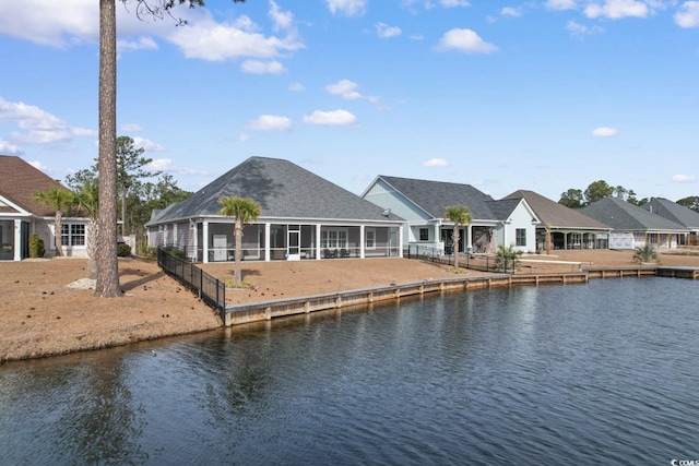 back of house with a water view