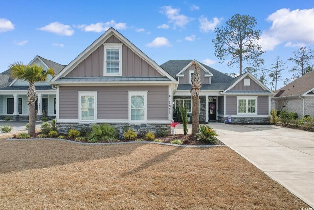 back of property with a sunroom and a lawn