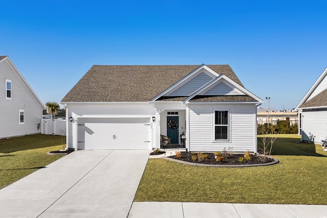 view of front facade featuring a garage and a front lawn