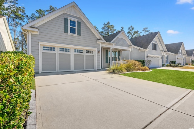 view of front of house with a garage and a front lawn