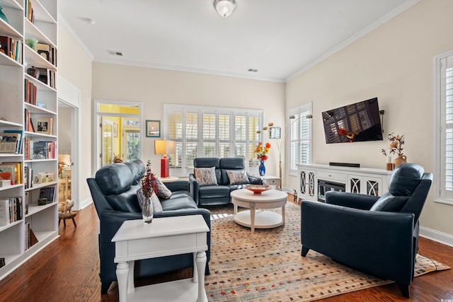 living room featuring crown molding and hardwood / wood-style floors