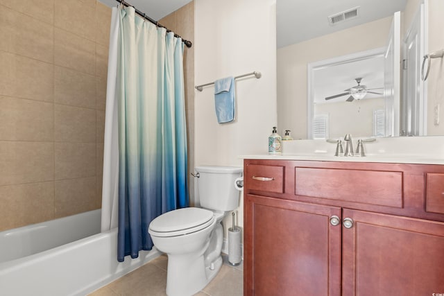 full bathroom featuring ceiling fan, tile patterned flooring, shower / tub combo, vanity, and toilet