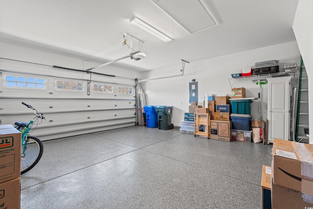 garage featuring a garage door opener and electric panel