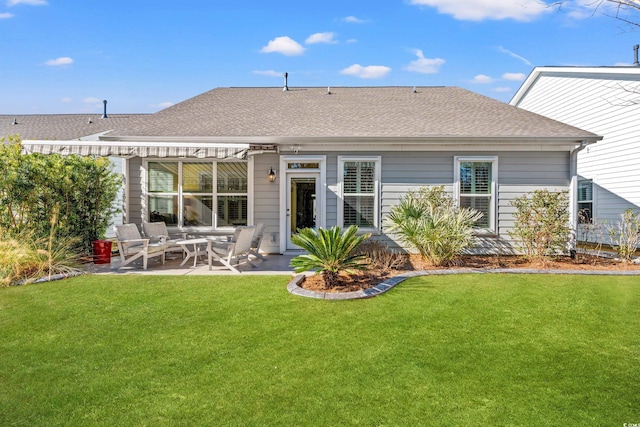 back of house featuring a yard and a patio area