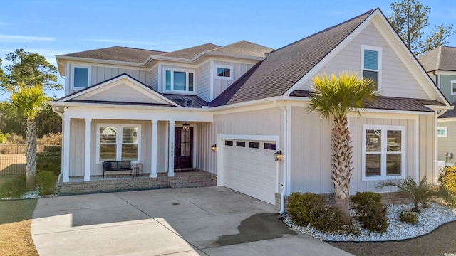 view of front of home featuring a garage and covered porch