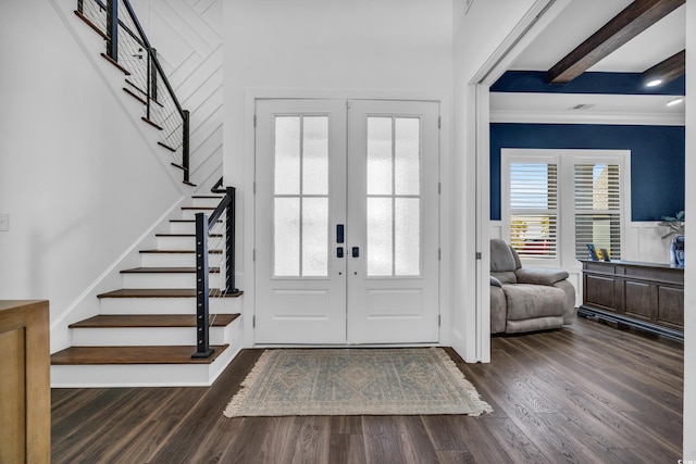 entryway with ornamental molding, dark wood-type flooring, and french doors