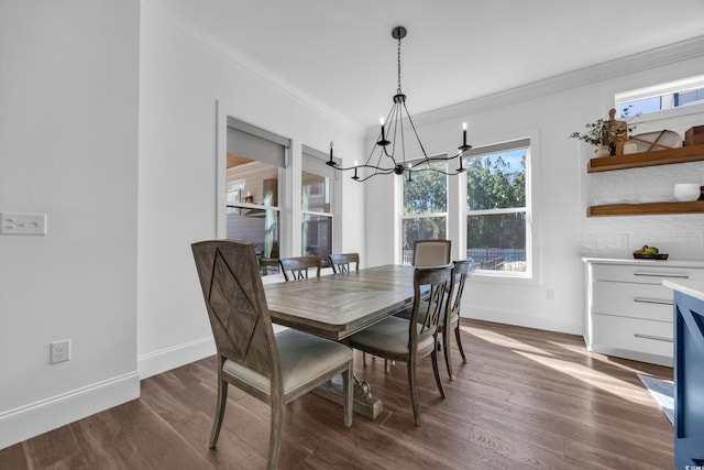 dining space featuring a notable chandelier, crown molding, and dark hardwood / wood-style floors