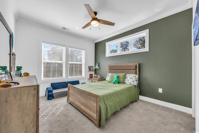 bedroom featuring crown molding, light colored carpet, and ceiling fan