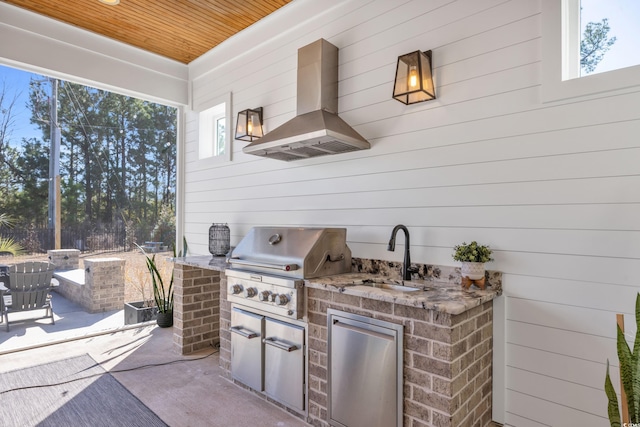 view of patio with exterior kitchen, sink, and grilling area