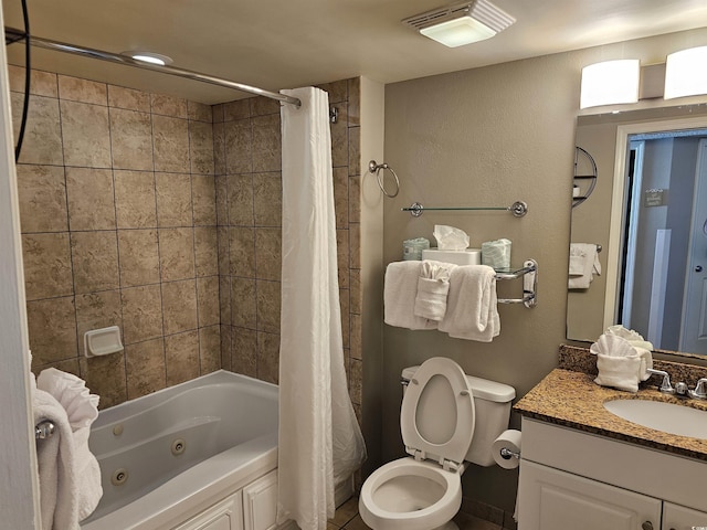 full bathroom featuring shower / tub combo with curtain, vanity, and toilet