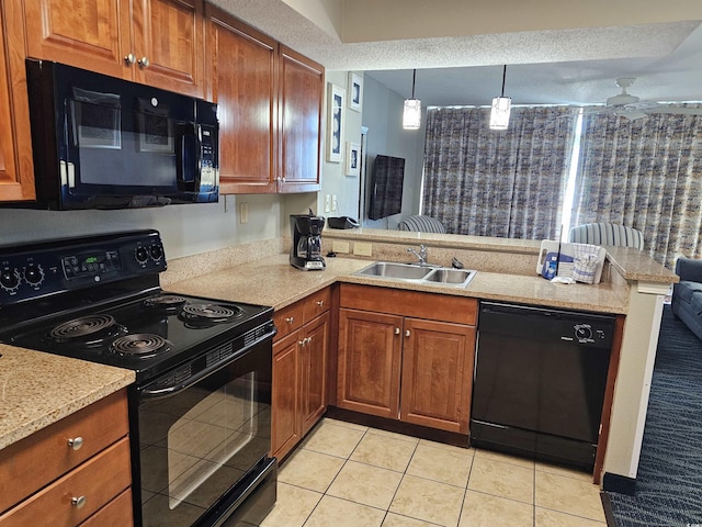 kitchen featuring pendant lighting, sink, black appliances, light tile patterned flooring, and kitchen peninsula