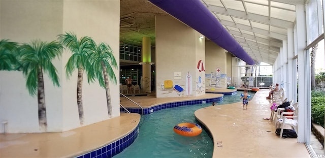 view of swimming pool featuring a patio area