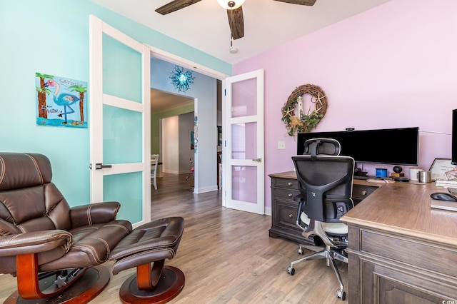 office area with french doors, ceiling fan, and light hardwood / wood-style flooring