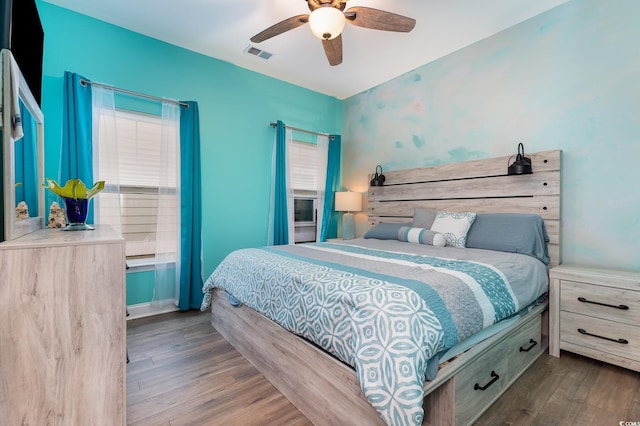 bedroom featuring hardwood / wood-style flooring and ceiling fan