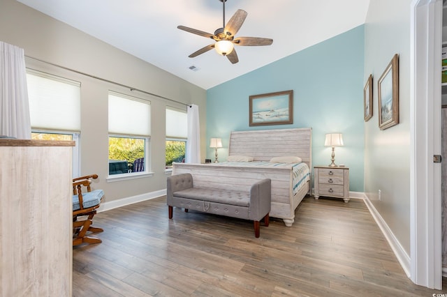 bedroom featuring hardwood / wood-style flooring, lofted ceiling, and ceiling fan