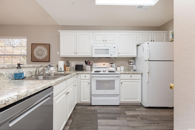 kitchen featuring white cabinetry, sink, dark wood-type flooring, and white appliances